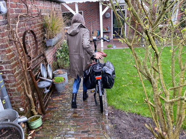 Woman extremly wet after a trip on her e bike