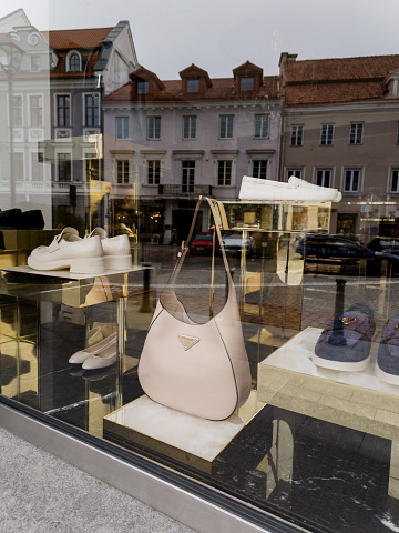 Lithuania, Vilnius, April 11, 2024 -  goods displayed inside Prada  -  Luxurious boutique shop window