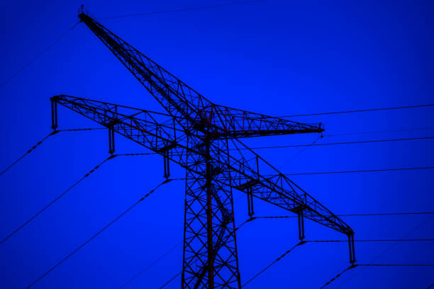 Close up old electricity power lines tower