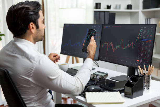 istock Trader businessman searching on smartphone, analyzing in dynamic stock. Surmise. 2148245928