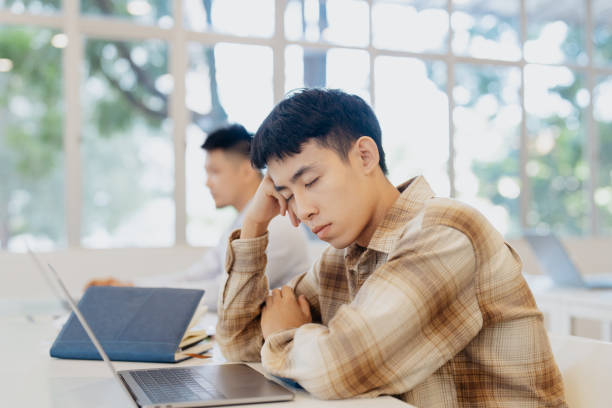 istock Asian Chinese university student feeling tired in classroom 2148246187