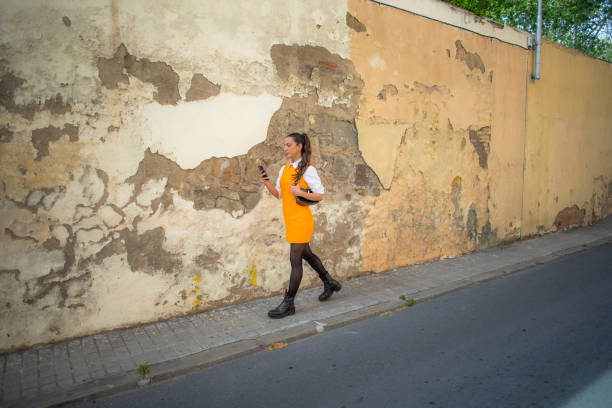 istock Woman using cell phone outdoors 2148247729
