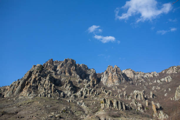 Mountains in spring Crimea against a background of blue sky and bright sunlight