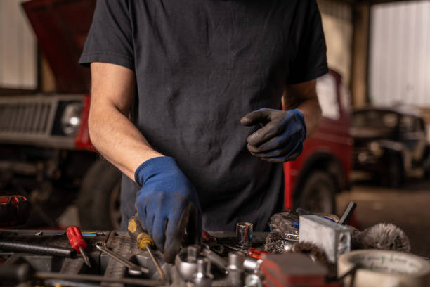 istock Repair shop owner chooses tool in workshop 2148253177