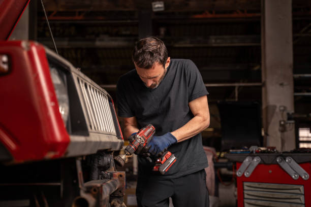 istock Mechanic repairs vehicle in shop 2148253293