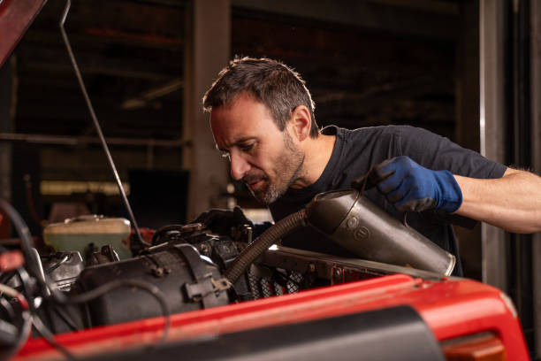 istock Mechanic repairs vehicle in shop 2148253343