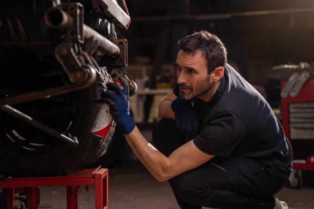 istock Mechanic repairs vehicle in shop 2148253345