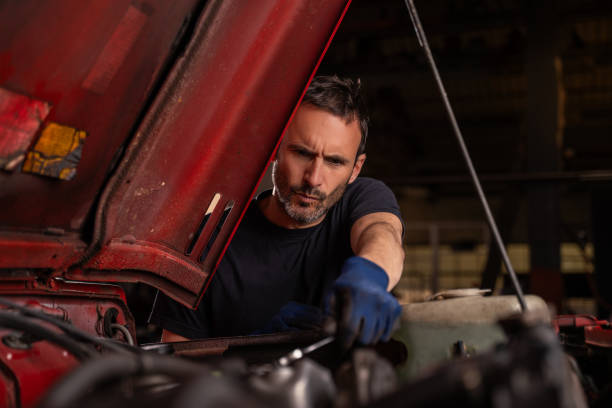 istock Mechanic repairs vehicle in shop 2148253420