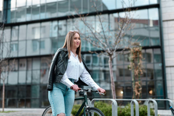 istock Cute Female Having Fun With Bicycle Outside 2148255003