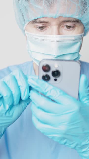 closeup of doctor using a mobile phone in the hospital