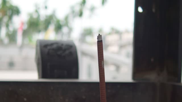 Burning Incense Sticks at a Buddhist Temple, Religious and Cultural Symbolism.