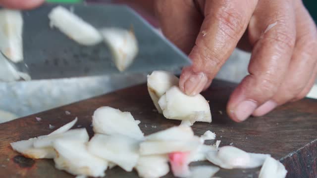 Slicing Fresh Galangal, Thai Cuisine and Aromatic Ingredients