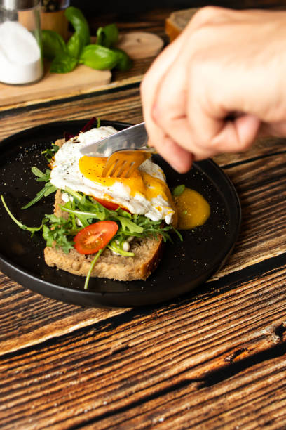 istock Sandwich with egg. on a wooden background. breakfast 2148257186