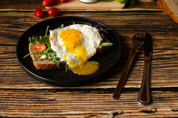 istock Sandwich with egg. on a wooden background. breakfast 2148257188