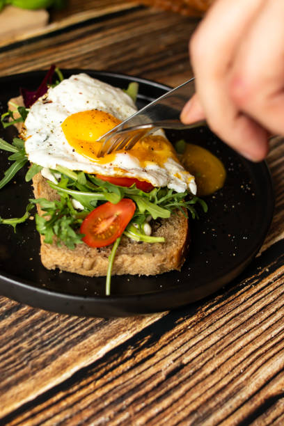 istock Sandwich with egg. on a wooden background. breakfast 2148257196