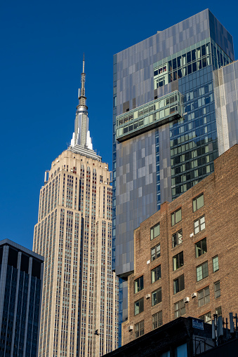 Manhattan, New York, USA - March, 2024. Buildings in front of the Empire State building.