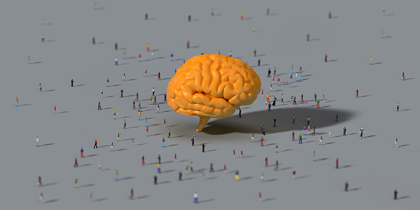Human crowd surrounding a yellow human brain model: AI Concept. Large group of 3D rendering people on coloured background top view, bird's eye view. Horizontal composition with copy space.