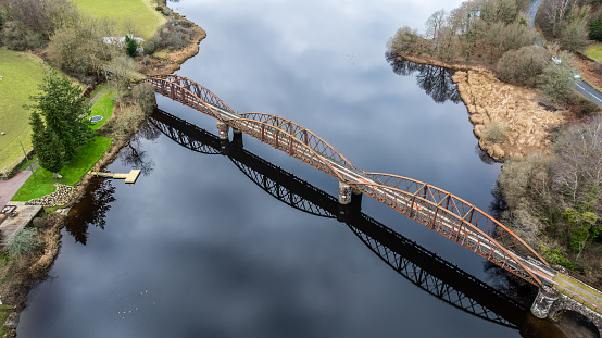 Drone photography of Abandoned Loch Ken railway viaduct at Parton, near Castle Douglas, Dumfries & Galloway, southern Scotland. The Railway Viaduct was abandoned in the 1970s. The Viaduct spans over Loch Ken.