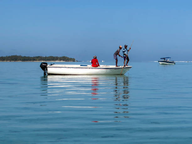 Le Morne, Mauritius - August 19th 2023 - Fishermen on the boat