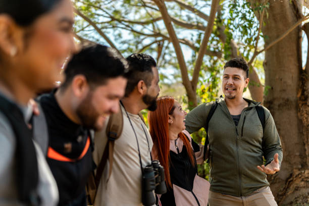 Friends talking during hiking in forest