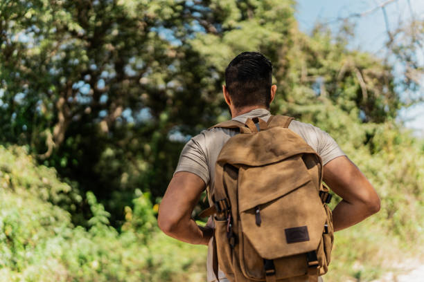 istock Mid adult man hiking in forest 2148260925