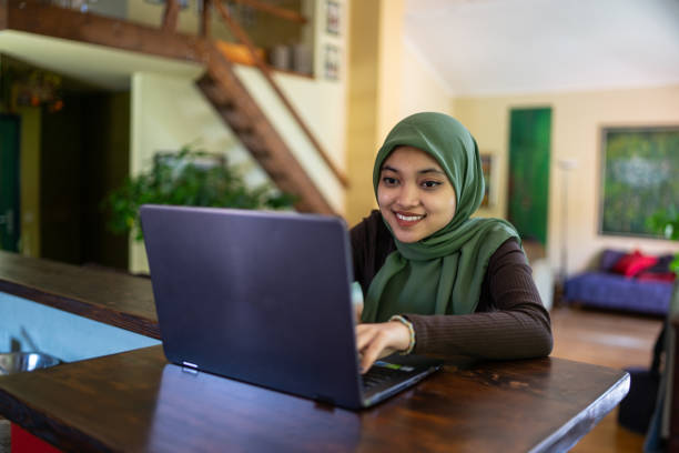 istock A close up of a young muslim student with a hijab using a laptop 2148262899