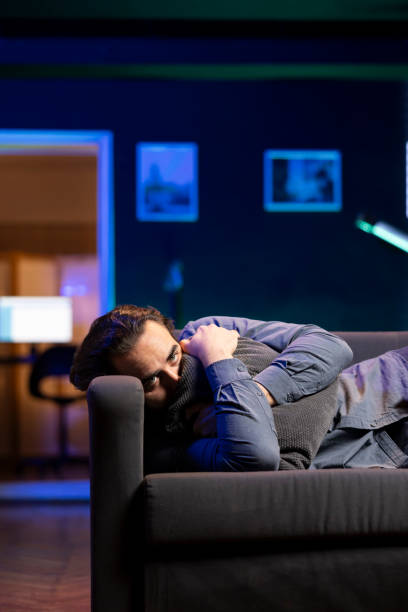 istock Person laying down hugging pillow seeing sad show, looking for emotional comfort 2148263213