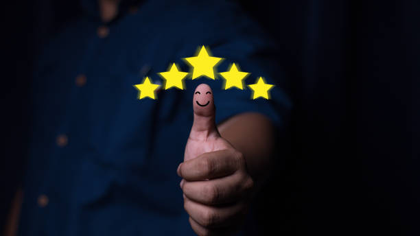 istock Customer service satisfaction concept. Hand with thumb up Positive emotion smiley face icon and five star with copy space. Satisfied, feedback, review, good, best, good product and service, quality 2148264422