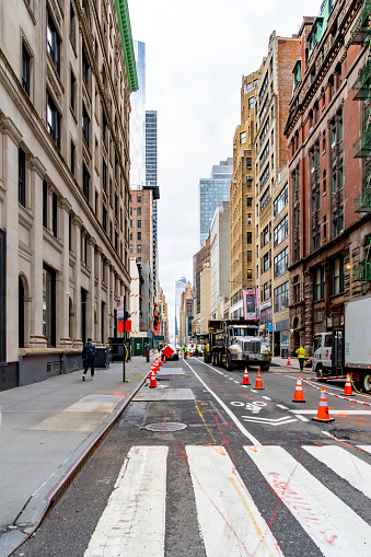 Manhattan, New York, USA - March, 2024.  View of Manhattan street with a construction site in New York.