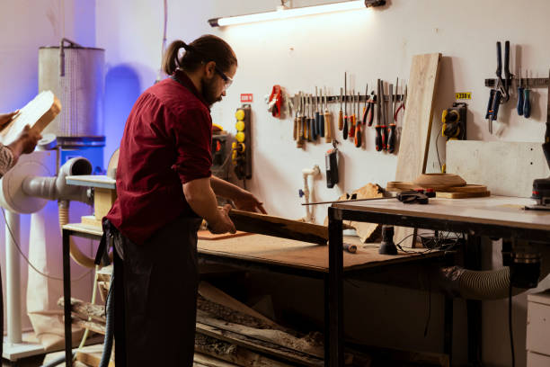 istock Cabinetmaker equipped with safety goggles to avoid injury 2148266092