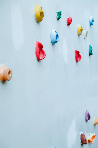 istock Colorful climbing holds on wall for outdoor rock climbing 2148267257