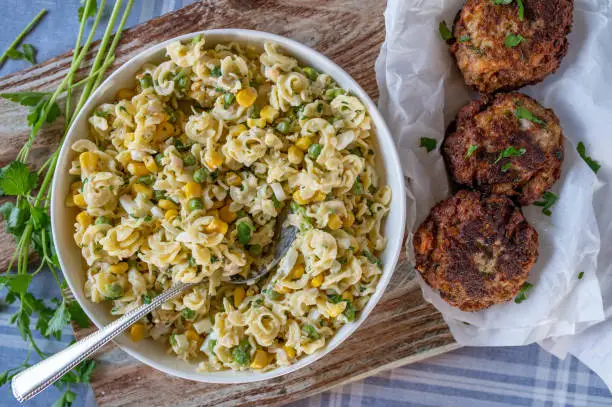 Pasta salad with german pork meatballs. Delicious party food served ready to eat on a table