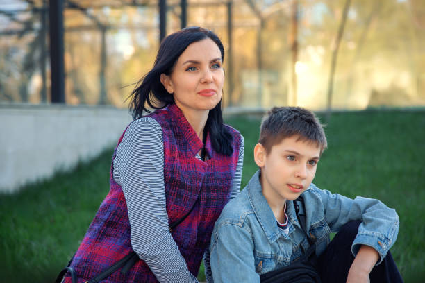 istock Woman and boy enjoying evening in the park 2148267625