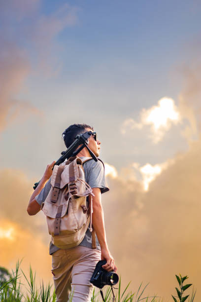 istock A photographer with sunlight illuminating their face. 2148267671