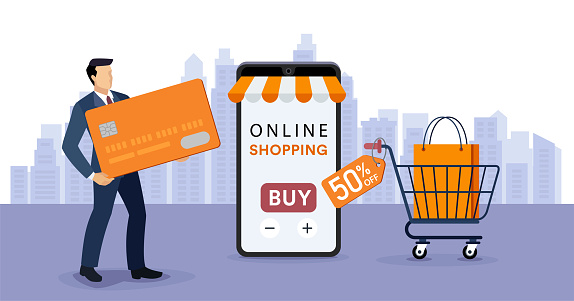 Online shopping and electronic commerce. A young Businessman holding a giant credit card.
