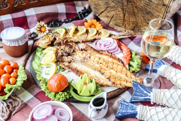 istock Fresh Fish and Colorful Vegetables on Wooden Table 2148270253