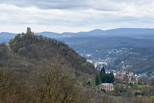 Königswinter, Germany, March 29, 2024 - The Drachenfels and the Drachenburg in the Rhine Valley seen from the Petersberg.