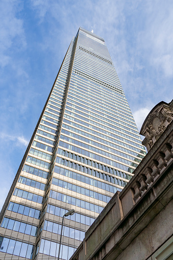 Low angle street photography of New York City.  View of the One World Trade Center in Manhattan.