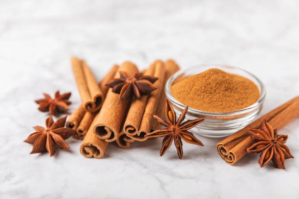 istock Cinnamon sticks and anise on a textured background. Cinnamon roll and star anise. Spicy spice for baking, desserts and drinks. Fragrant ground cinnamon.Place for text. copy space. 2148272768