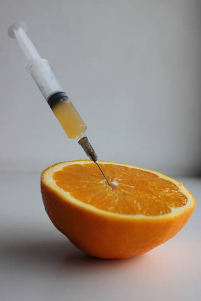 istock A syringe with fresh juice from a ripe orange cut in half 2148272972