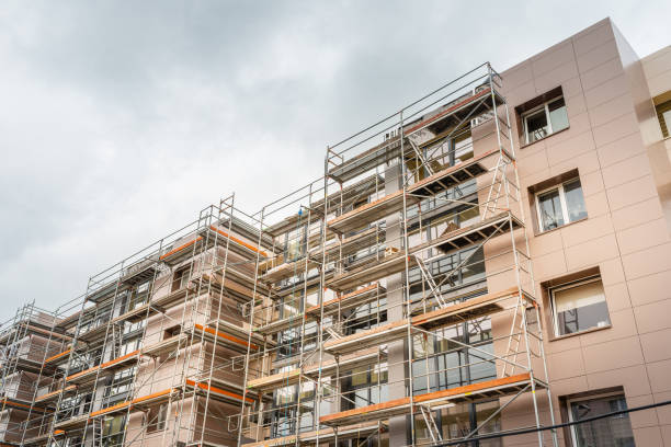 istock Tall building under construction with scaffolds.Scaffolding on multi storey building facade during renovation.Telsiai,Lithuania 05-31-2022. 2148274908