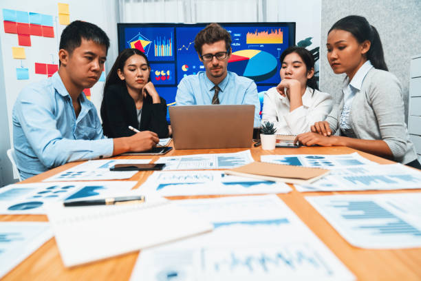 istock Group of business analyst team analyzing financial data report. Habiliment 2148274979