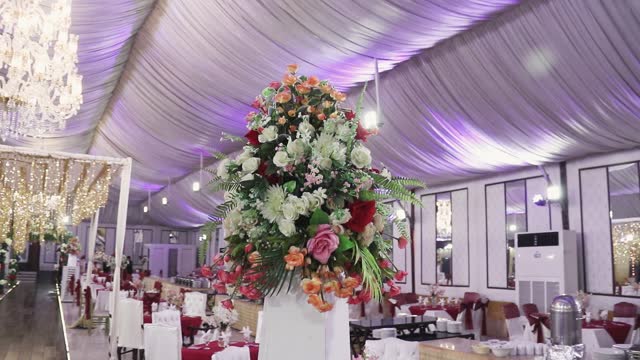 The stunning bouquet in the forefront is complemented by the entire exquisite banquet displayed in the background.