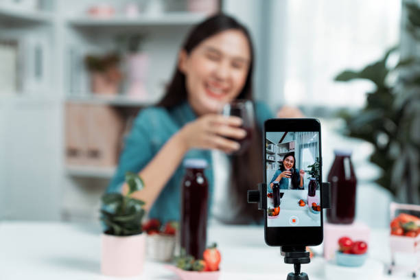 istock Selective focus phone mixed strawberry and cherry juice drinks. Stratagem. 2148275664