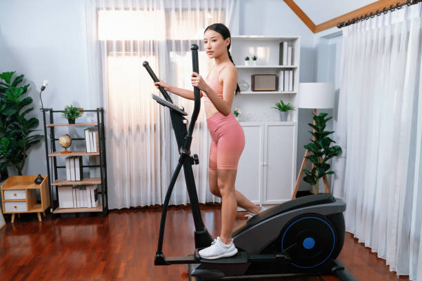 istock Energetic and strong athletic asian woman running on machine. Vigorous 2148275806