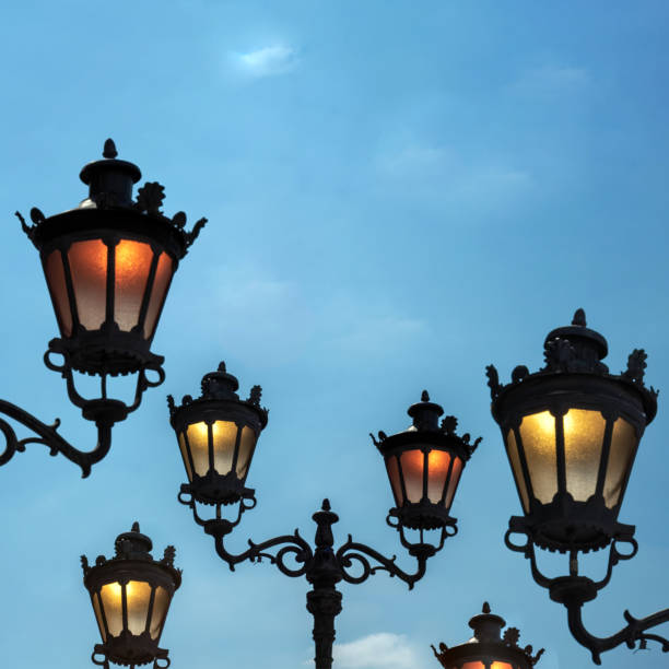 istock Vintage streetlamp creative concept on a blue sky. 2148276836