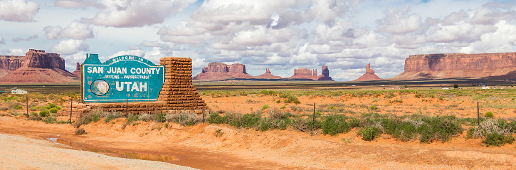 Welcome sign in desert for San Juan County in Monument Valley, Utah.