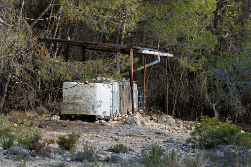 Water tank installed in the Sierra de Mariola natural park so that the fauna can quench their thirst, Alcoy, Spain