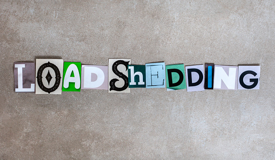 Load shedding in magazine letters on mottled grey with copy space.
South Africa electricity crises