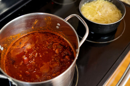A pot of homemade chili on a stove